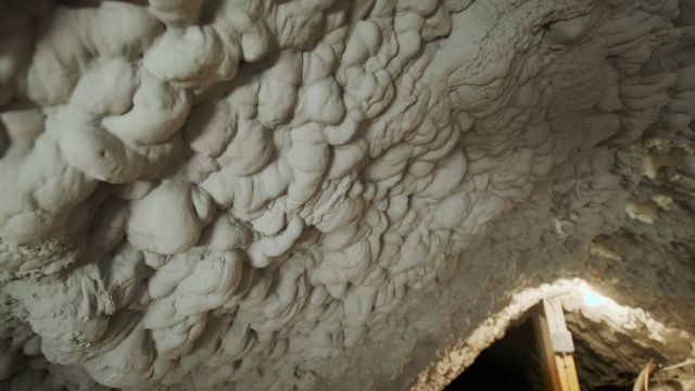 thermal-insulation-installing-at-the-attic-the-roof-close-up-view-SBI-351369671